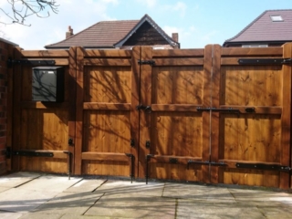 Bi-fold softwood gates with postbox