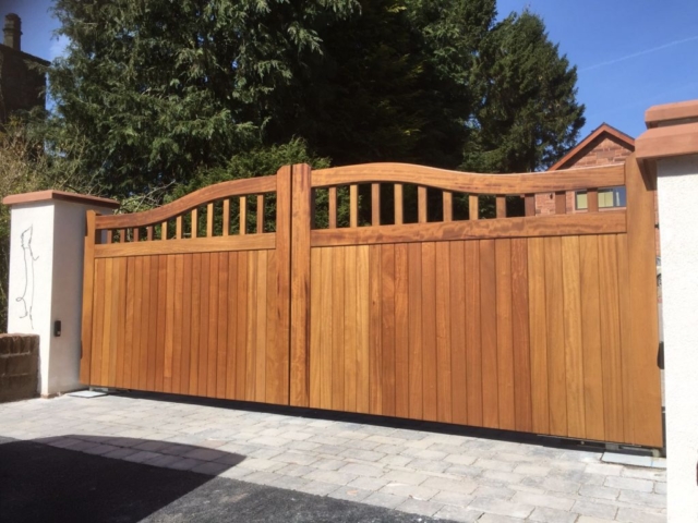 Iroko hardwood chester design driveway gates in natural finish