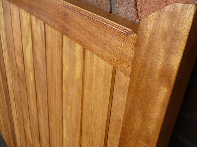 close up of wooden gate with glossy finish