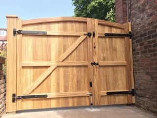 iroko hardwood assymetrical gates in natural finish